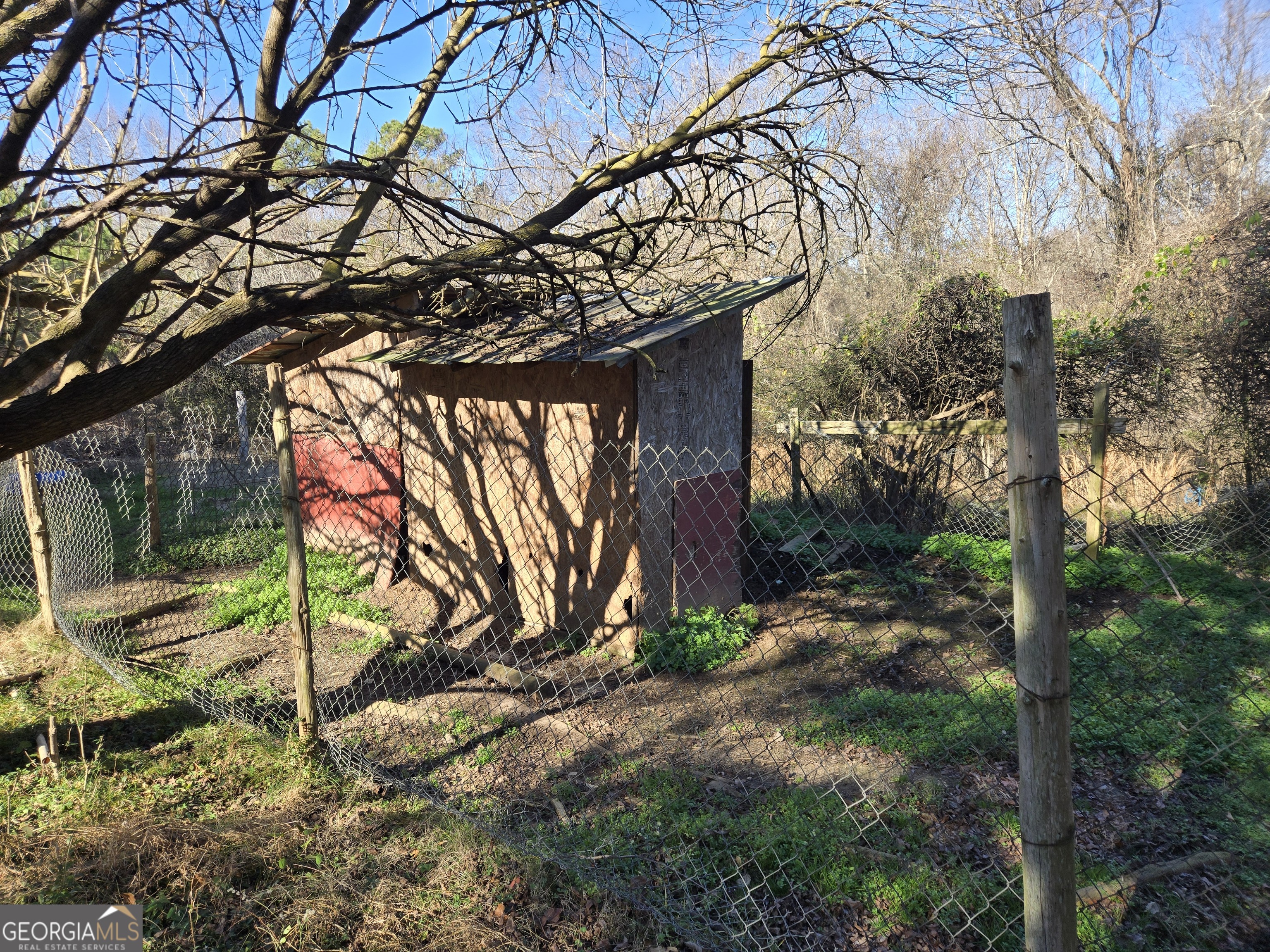 646 Walters Road Lavonia, GA 30553 - Photo 8 of 14 a backyard of a house with lots of green space and fountain