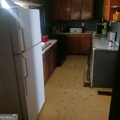 a view of a elevator with a door and chair