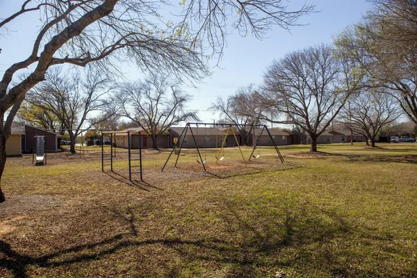 a view of yard covered with trees