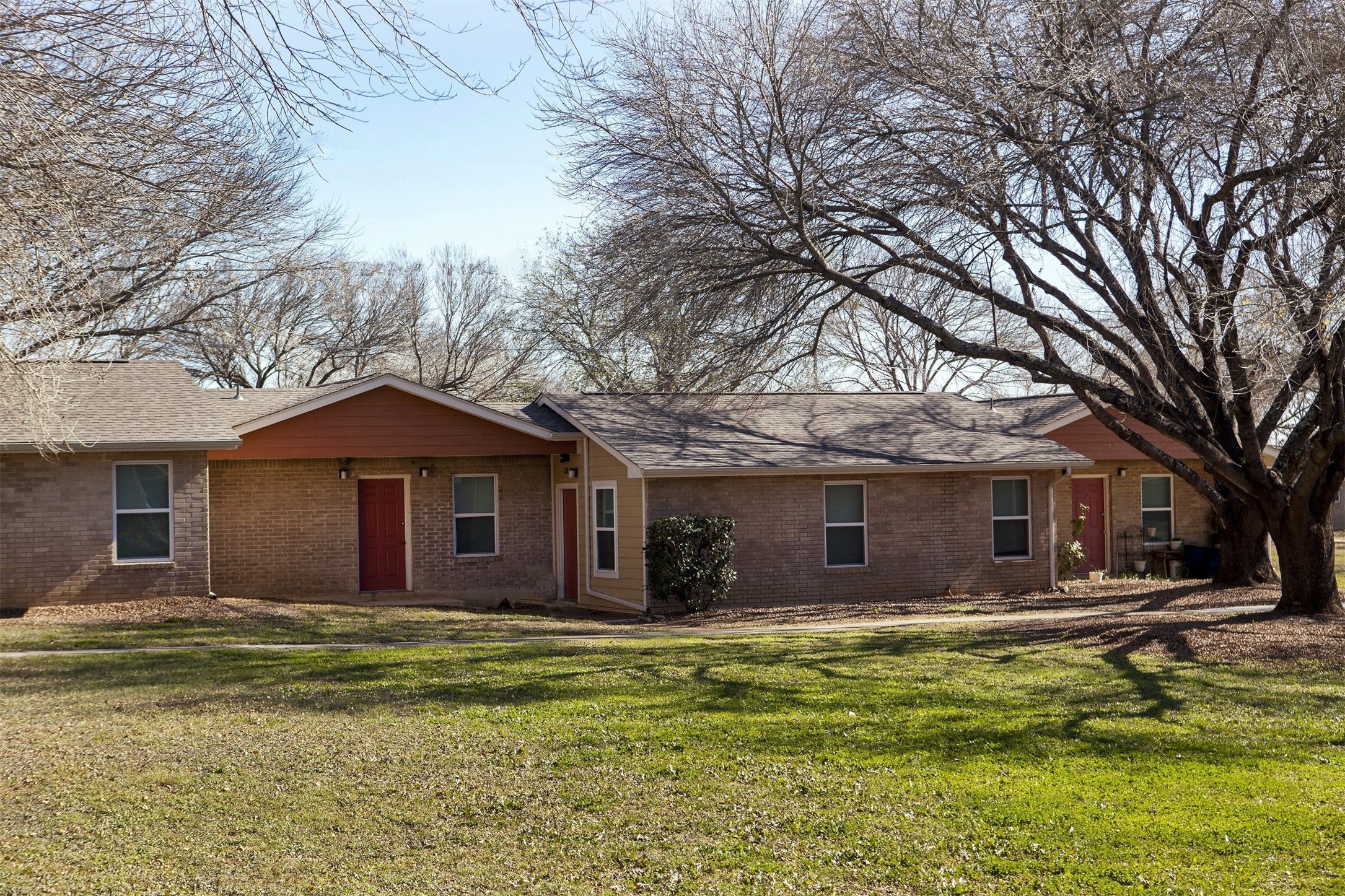 1200 East Frio Street Pearsall, TX 78061 - Photo 2 of 12 a front view of a house with a garden