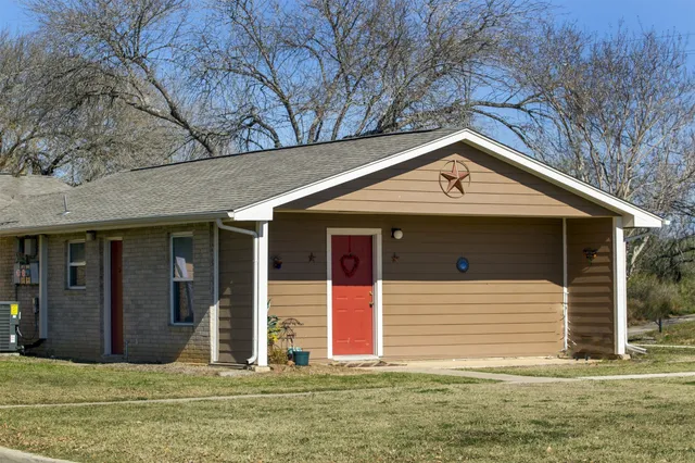 a front view of a house with garage