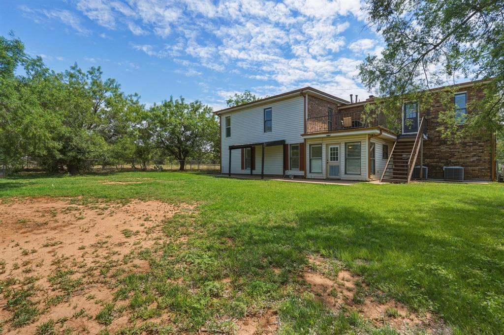 432 Clark Road Abilene, TX 79602 - Photo 35 of 40 a view of a house with a yard