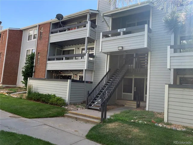 a front view of a house with a park
