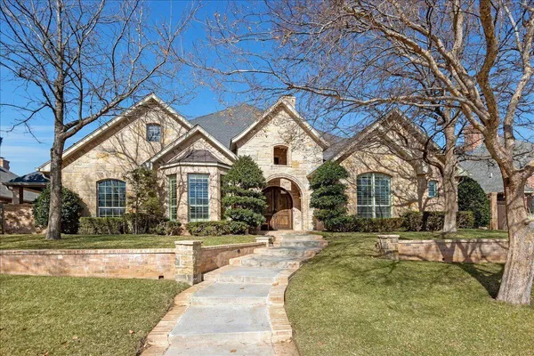 a view of a livingroom with wooden floor and a fireplace