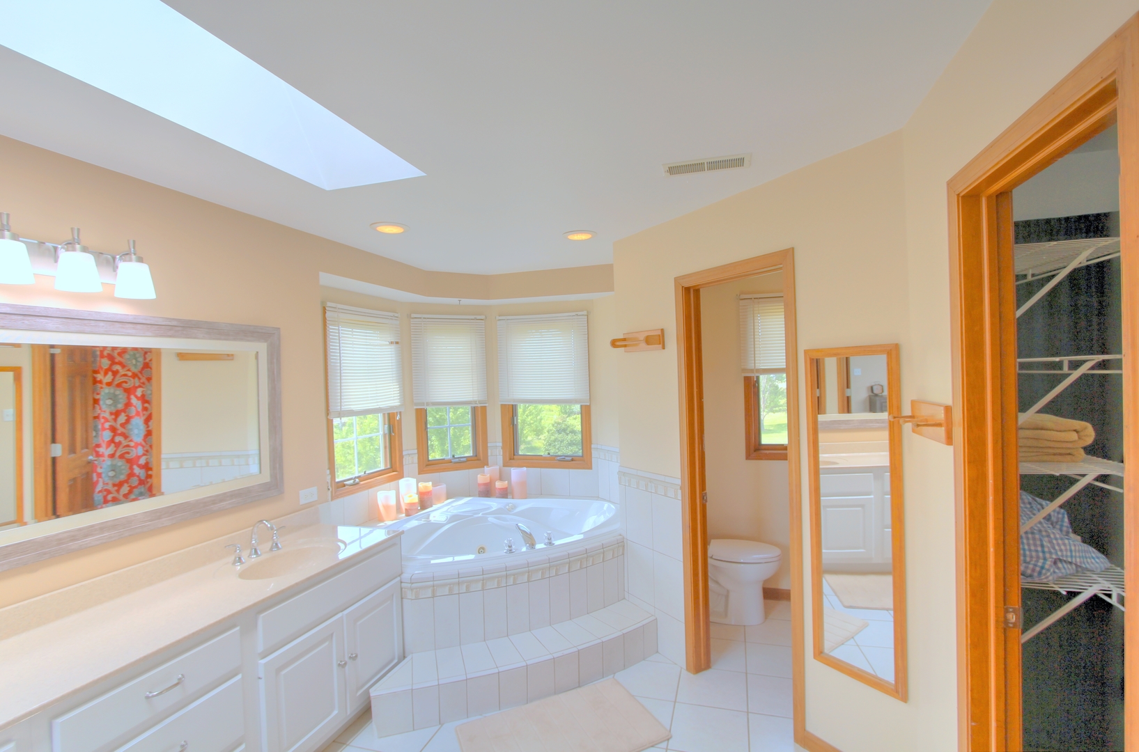 2803 East 2575th Road Marseilles, IL 61341 - Photo 18 of 30 a spacious bathroom with a granite countertop tub shower and mirror