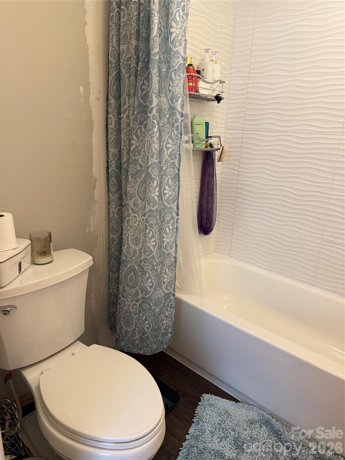 1304 Seaton Road, Unit 15 Durham, NC 27713 - Photo 13 of 20 a white toilet sitting next to a bath tub and a shower