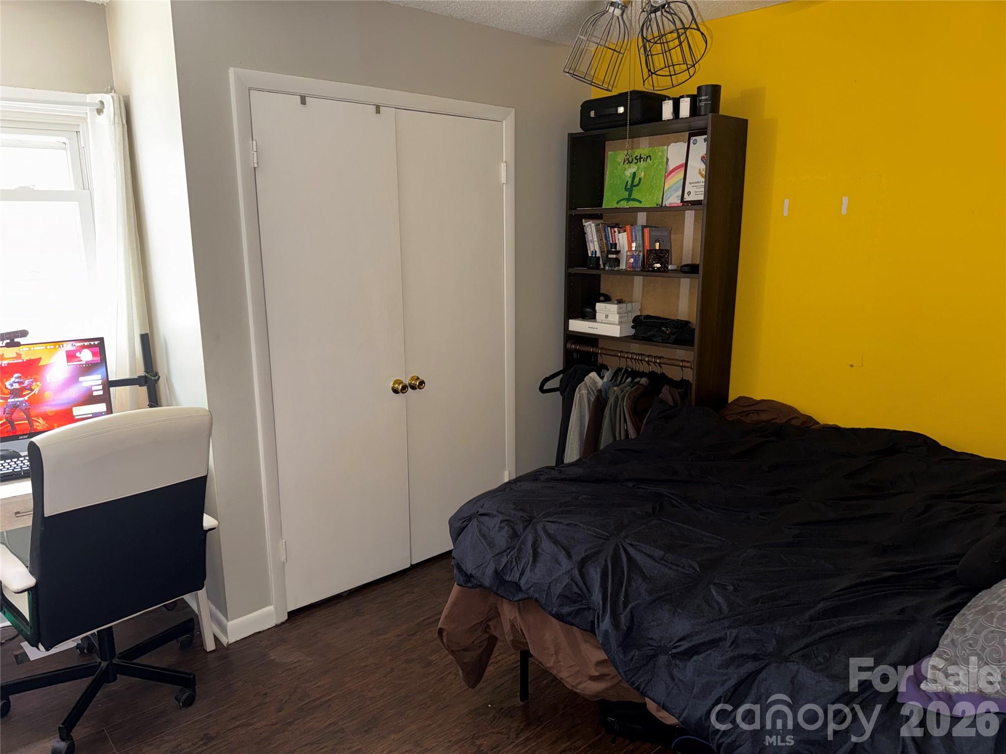 1304 Seaton Road, Unit 15 Durham, NC 27713 - Photo 17 of 20 a bedroom with a bed and a window