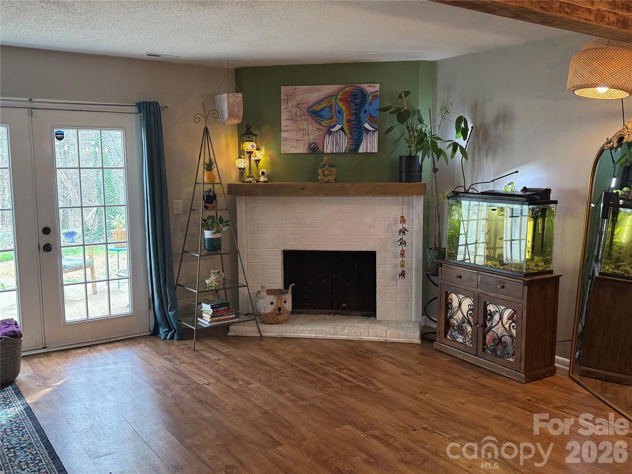 1304 Seaton Road, Unit 15 Durham, NC 27713 - Photo 2 of 20 a view of a livingroom with a fireplace and a window