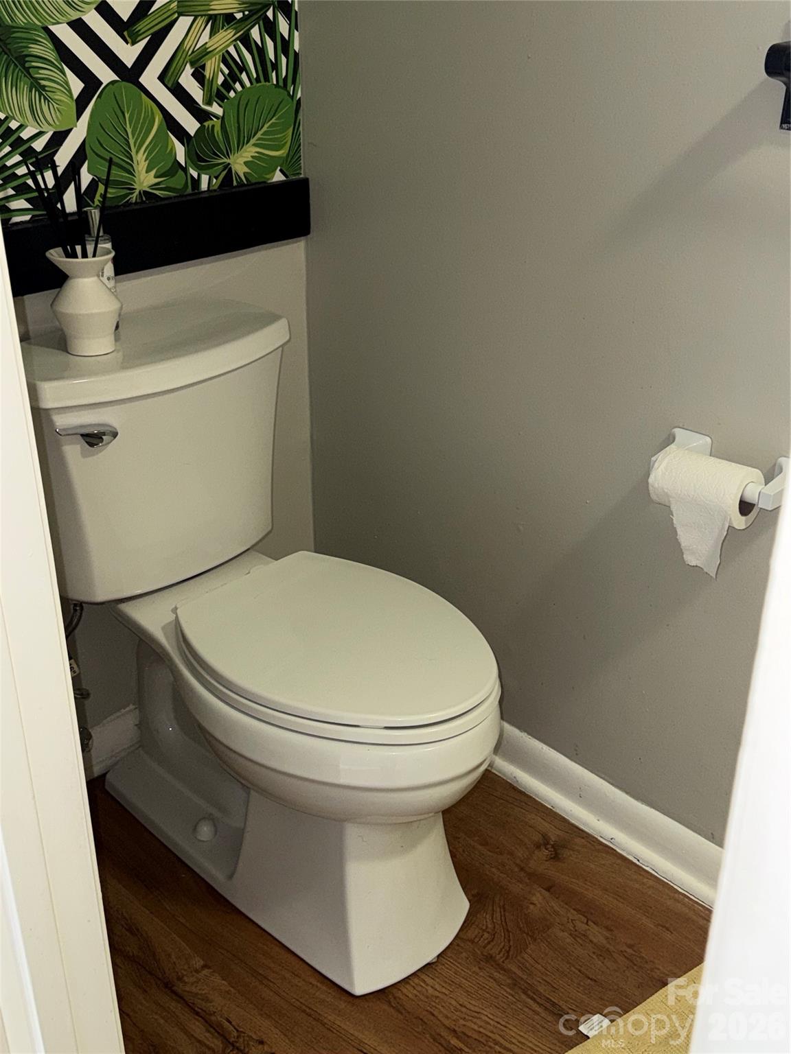 1304 Seaton Road, Unit 15 Durham, NC 27713 - Photo 9 of 20 a white toilet sitting next to a white sink and vanity