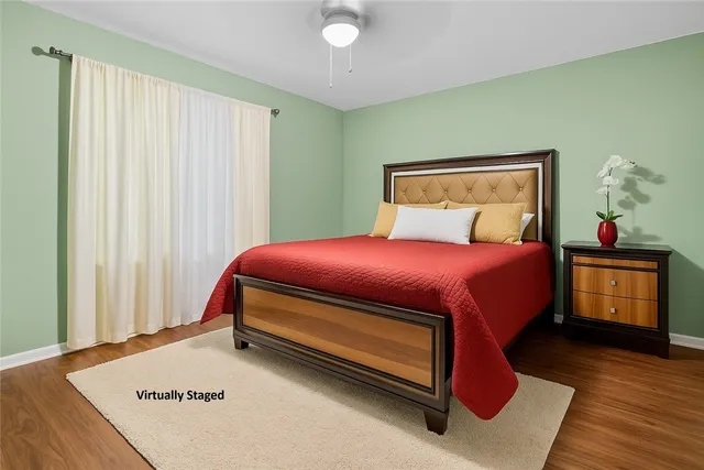 a bedroom with a bed and a dresser