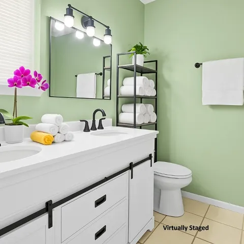 a bathroom with a sink a toilet and mirror