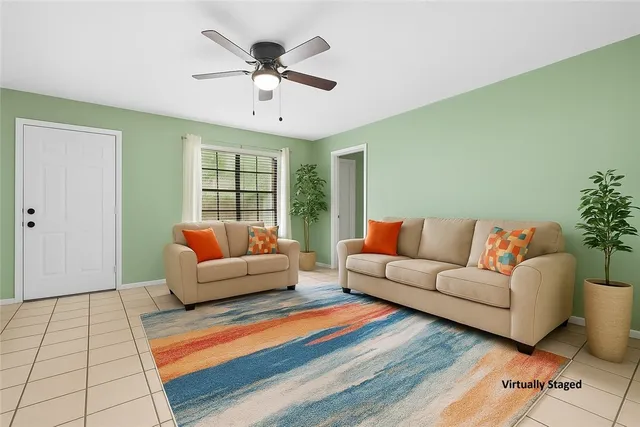 a living room with furniture and a large window
