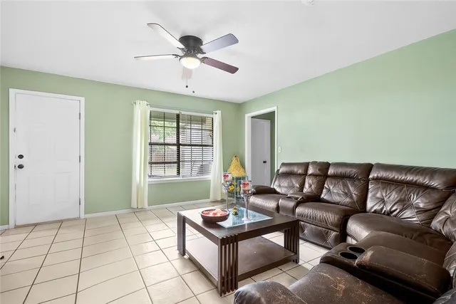a living room with furniture and a window