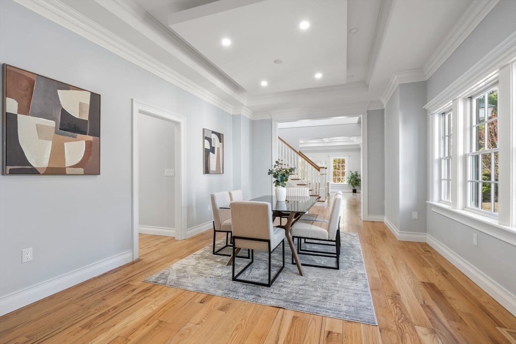10 Hitching Post Lane Weston, MA 02493 - Photo 7 of 42 a dining room with wooden floor and a rug