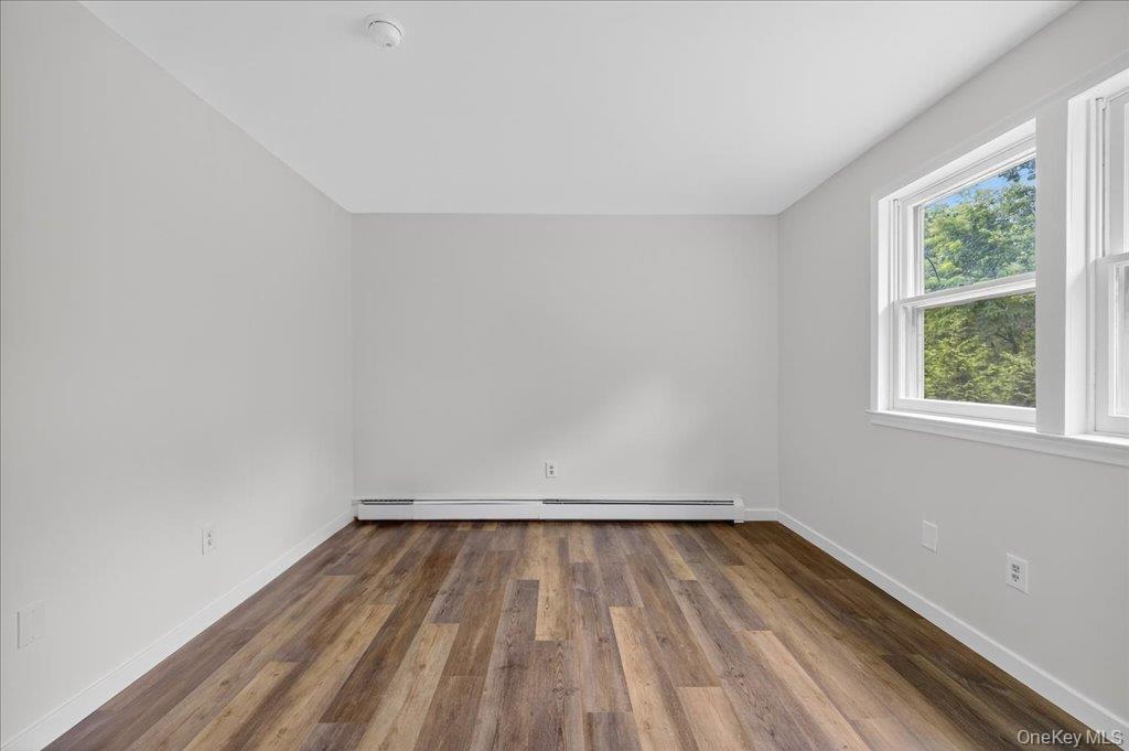 226 Knoth Road Wallkill, NY 12589 - Photo 19 of 34 a view of room with wooden floor and fan