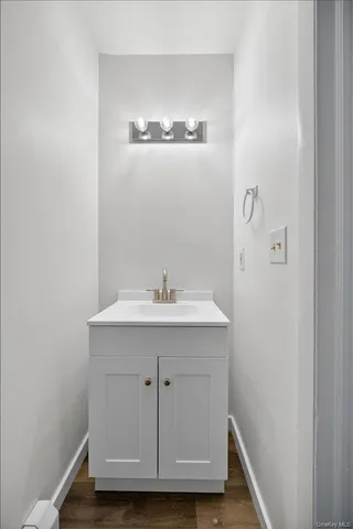 a bathroom with a sink and mirror