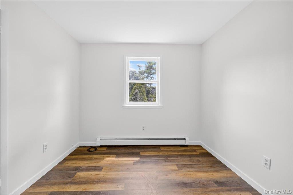 226 Knoth Road Wallkill, NY 12589 - Photo 21 of 34 a view of a room with wooden floor and window