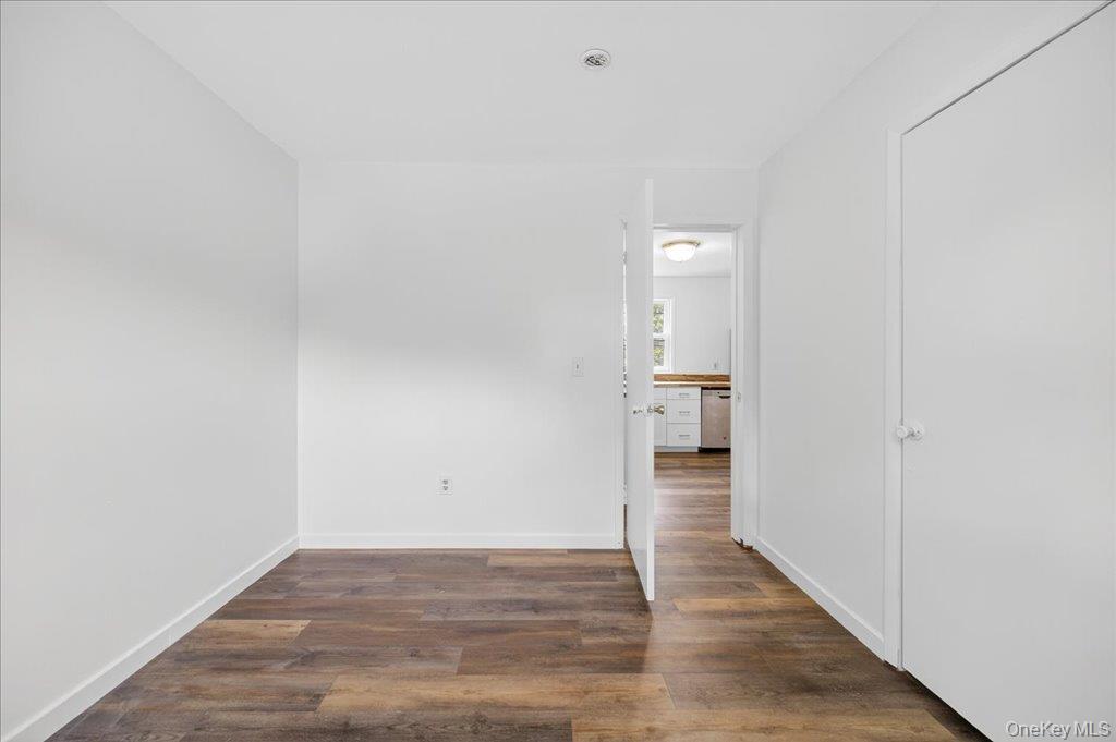 226 Knoth Road Wallkill, NY 12589 - Photo 22 of 34 a view of a hallway with wooden floor and staircase