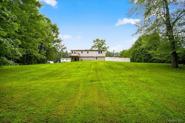 a view of a garden with a building in the background