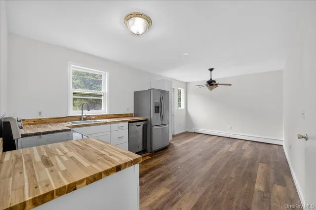 a kitchen with a sink and refrigerator