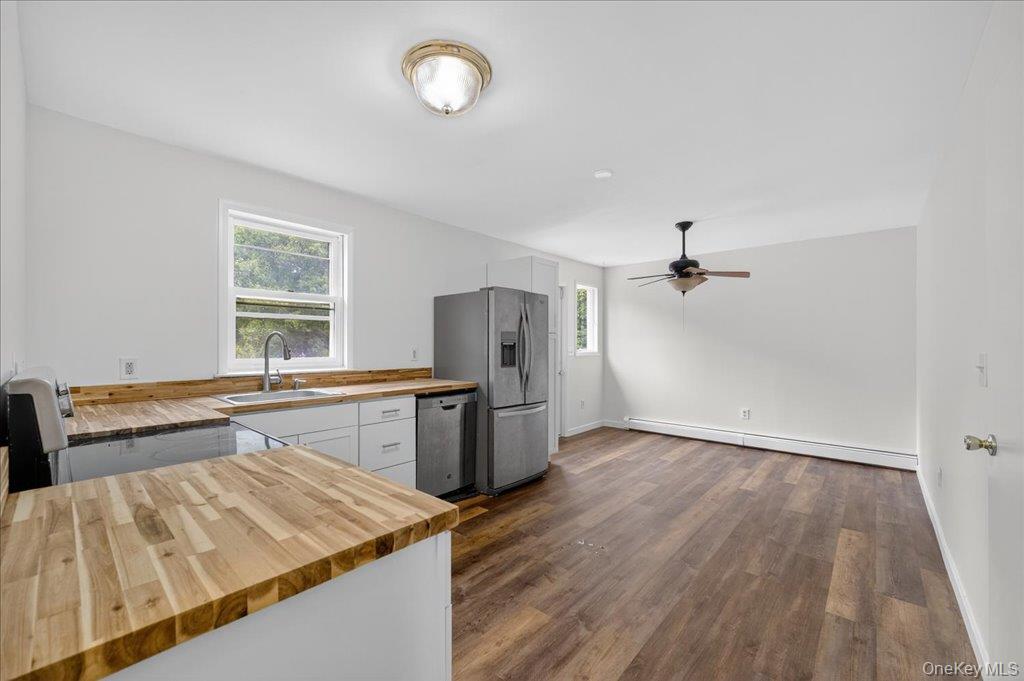 226 Knoth Road Wallkill, NY 12589 - Photo 8 of 34 a kitchen with a sink and refrigerator