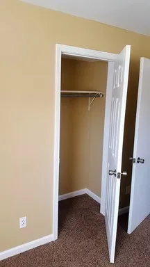 a white toilet sitting next to a bath tub