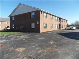 a front view of building with yard