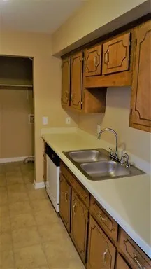 a kitchen with stainless steel appliances granite countertop a refrigerator and a stove