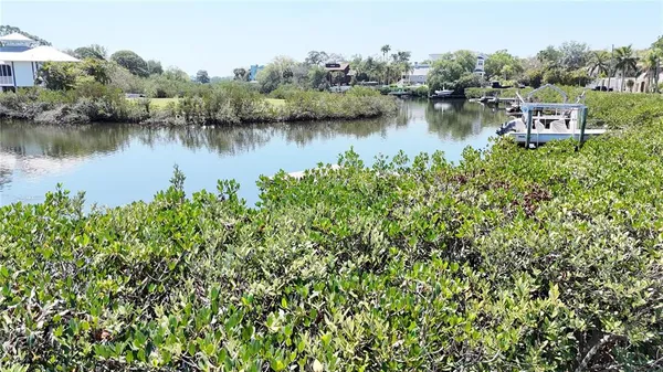 an aerial view of residential house with outdoor space and lake view