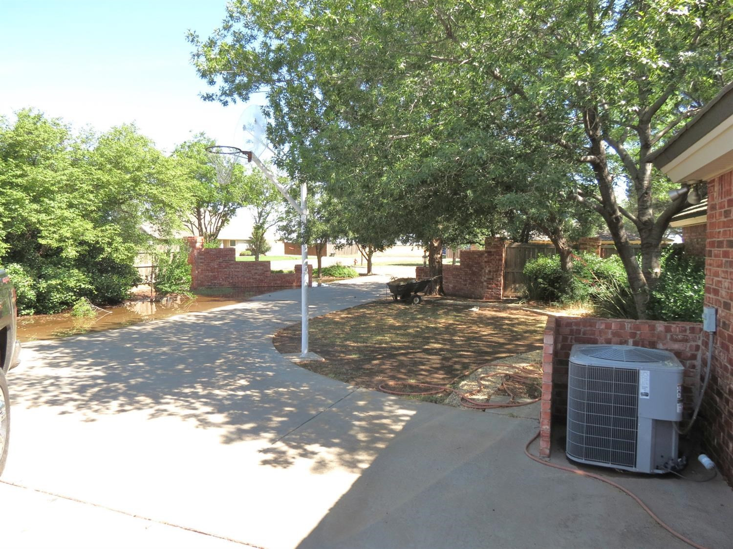 1310 17th Street Ralls, TX 79357 - Photo 3 of 10 a view of a tree in front of a house
