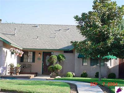 1490 West Kramer Ridge Road Reedley, CA 93654 - Photo 2 of 3 Deck outside front door and large covered deck in huge back yard.