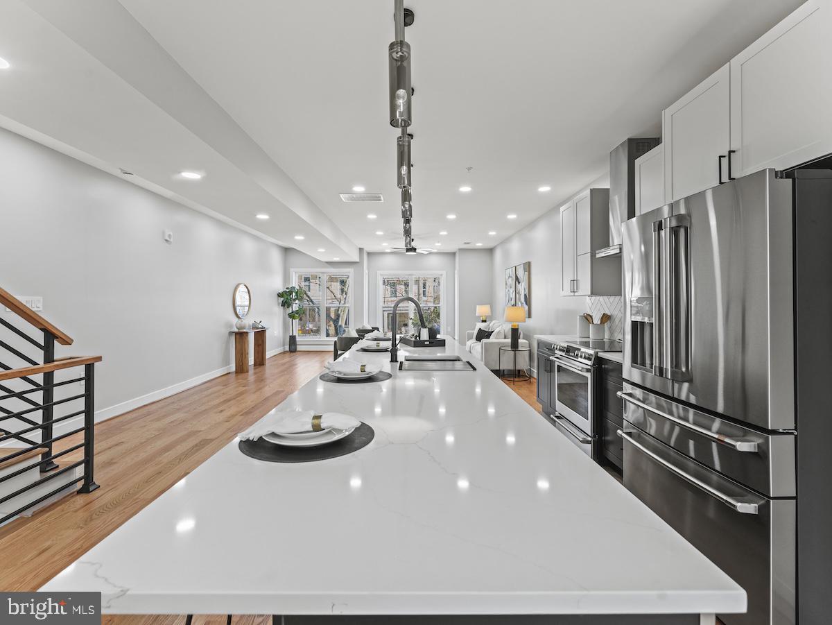 4318 7th Street Northwest, Unit 2 Washington, DC 20011 - Photo 13 of 33 Sleek modern kitchen with bright ambiance.