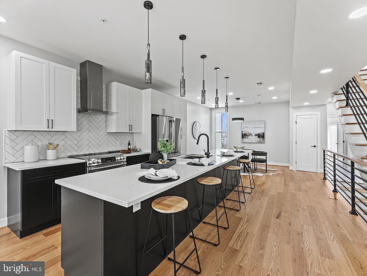 4318 7th Street Northwest, Unit 2 Washington, DC 20011 - Photo 14 of 33 Sleek modern kitchen with elegant finishes.