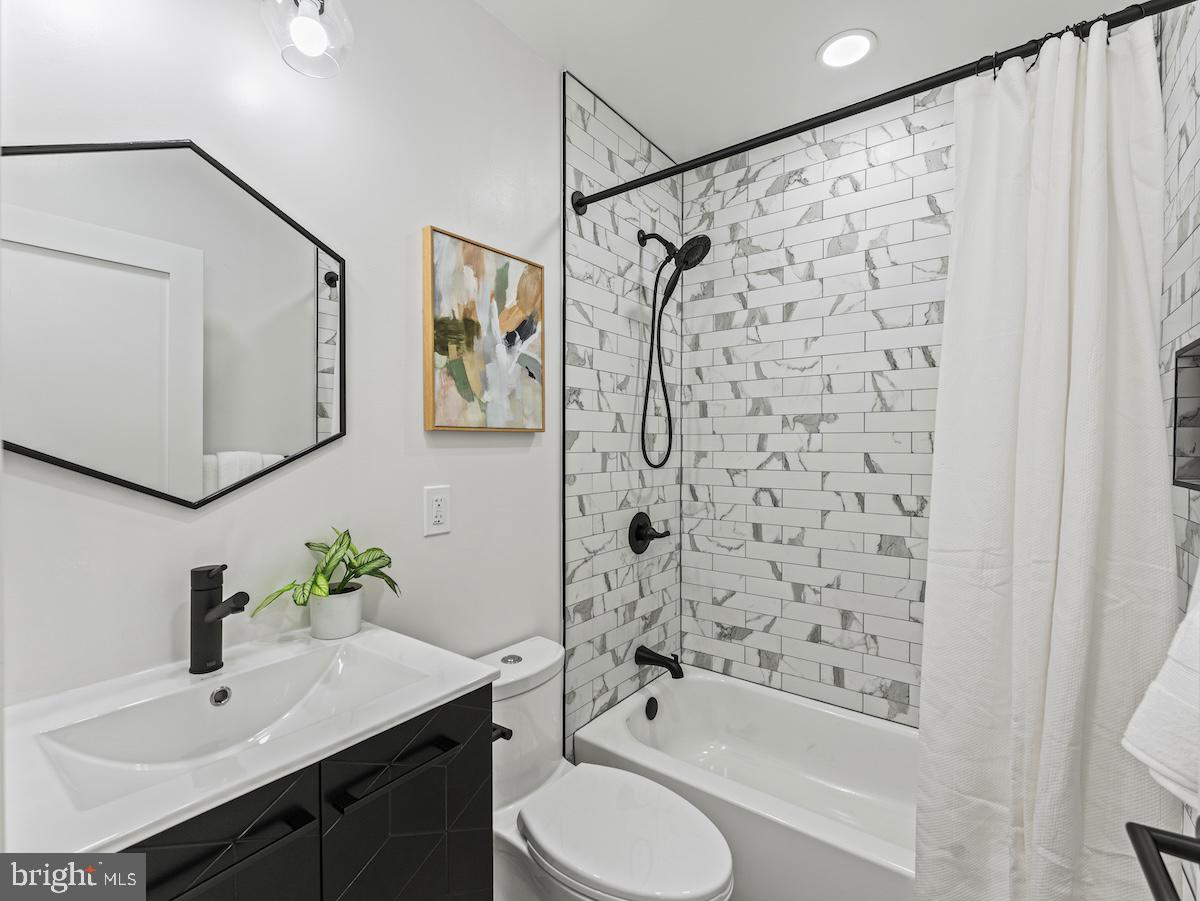 4318 7th Street Northwest, Unit 2 Washington, DC 20011 - Photo 22 of 33 Sleek modern bathroom with stylish tiles.