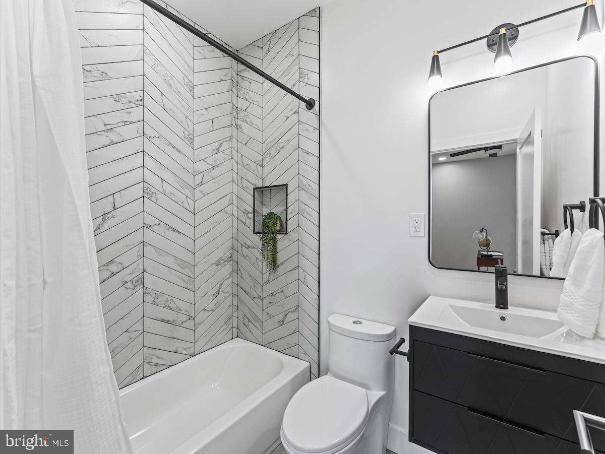 4318 7th Street Northwest, Unit 2 Washington, DC 20011 - Photo 25 of 33 Sleek modern bathroom with chic accents.