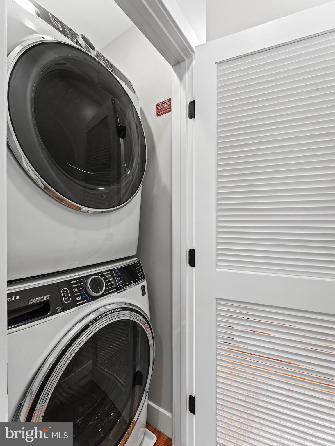 4318 7th Street Northwest, Unit 2 Washington, DC 20011 - Photo 26 of 33 Sleek laundry nook with modern appliances.