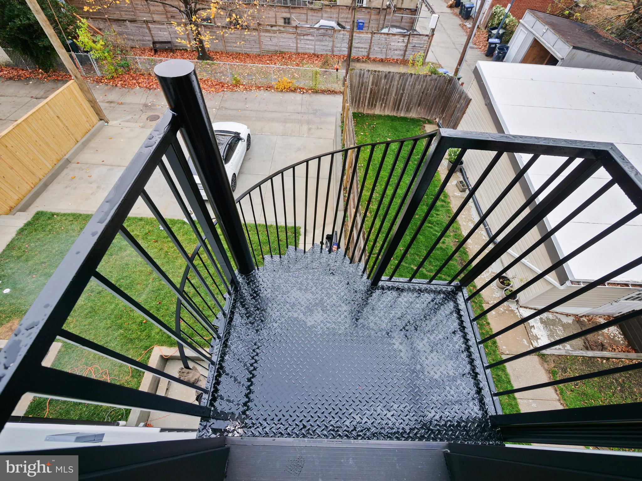 4318 7th Street Northwest, Unit 2 Washington, DC 20011 - Photo 33 of 33 Spiral staircase with urban views.