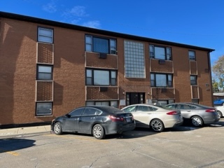 6625 Pershing Road, Unit 3 Stickney, IL 60402 - Photo 1 of 13 a car parked in front of a brick building