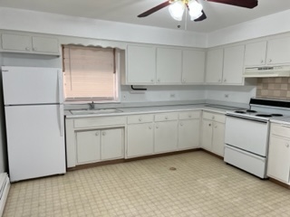 6625 Pershing Road, Unit 3 Stickney, IL 60402 - Photo 11 of 13 a kitchen with white cabinets