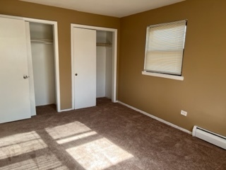 6625 Pershing Road, Unit 3 Stickney, IL 60402 - Photo 6 of 13 an empty room with windows and closet