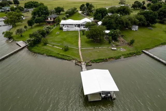 a swimming pool with some trees in the background
