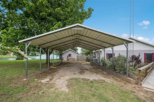 a front view of a house with yard and porch
