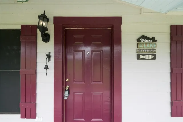 a view of a porch with a table and chairs