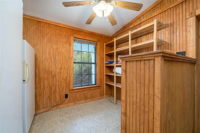 a bed room with a bed and a chandelier