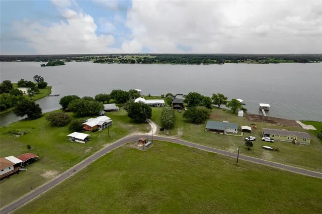 a view of a swimming pool and a yard