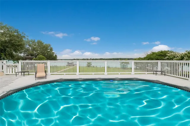 a view of a deck with a big yard
