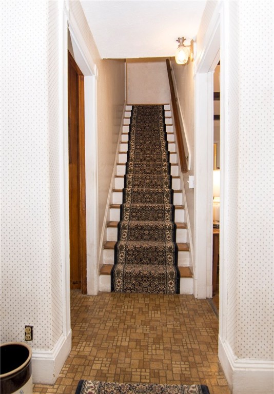 5 Beckside Road North Providence, RI 02911 - Photo 16 of 32 Staircase with wood treads and custom carpeting.