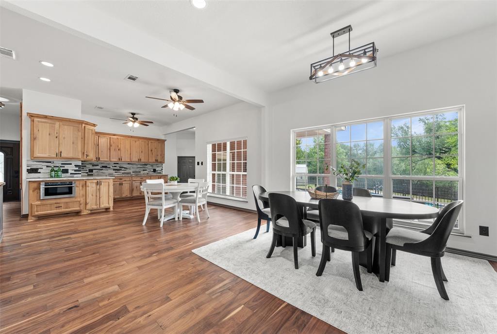 3091 Rockbridge Road McGregor, TX 76657 - Photo 9 of 40 a view of a dining room with furniture and chandelier