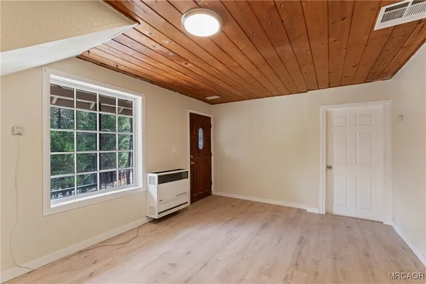 a view of an empty room with a window