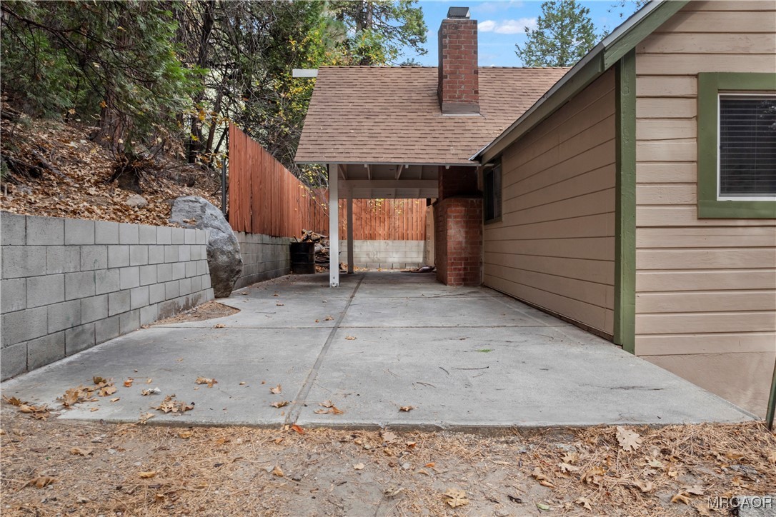 26791 Highway 189 Twin Peaks, CA 92391 - Photo 32 of 39 a view of a house with a wooden fence